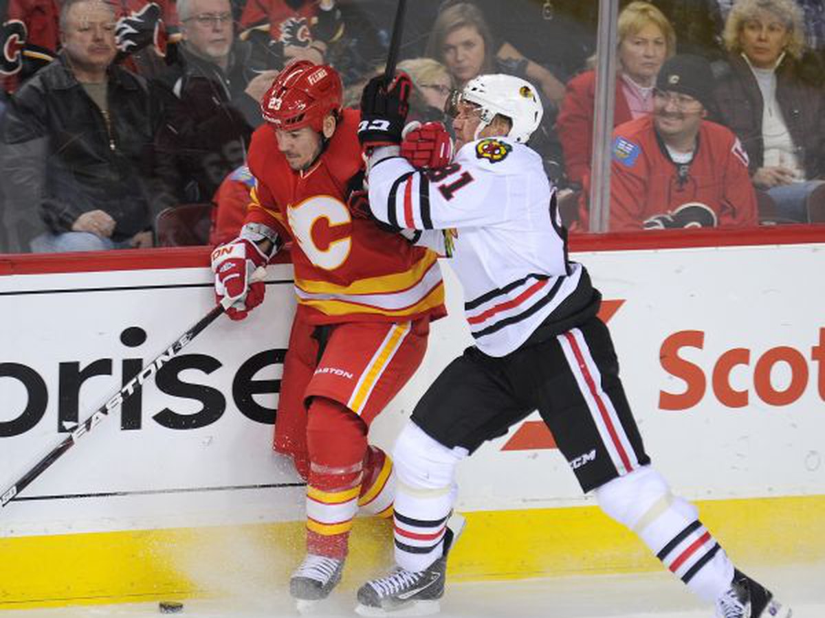 Scott Hannan a Marián Hossa