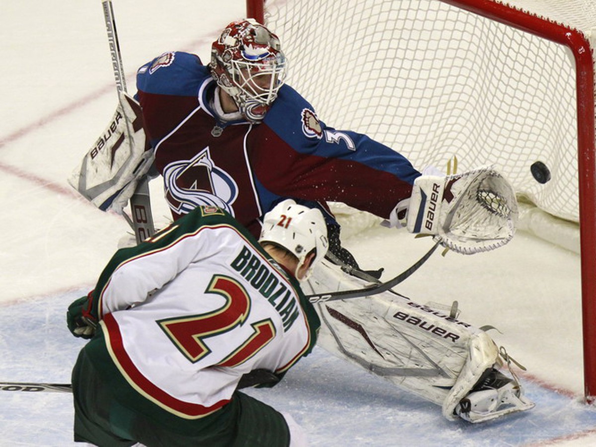 Kyle Brodziak a Peter Budaj