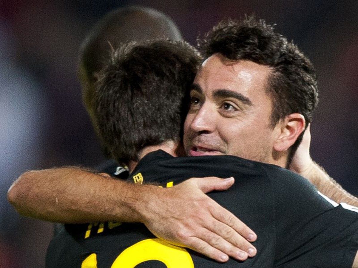 Messi a Xavi