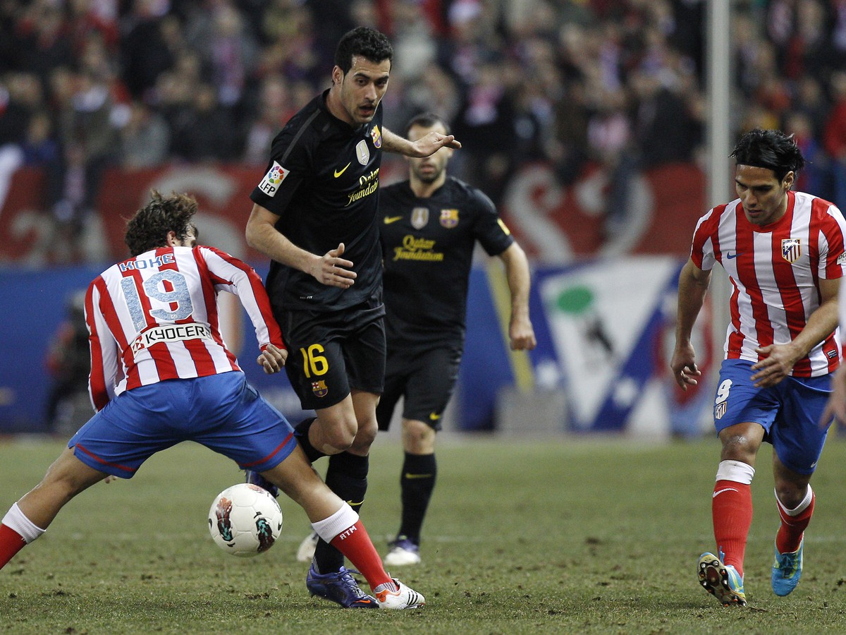 Koke a Sergio Busquets v súboji