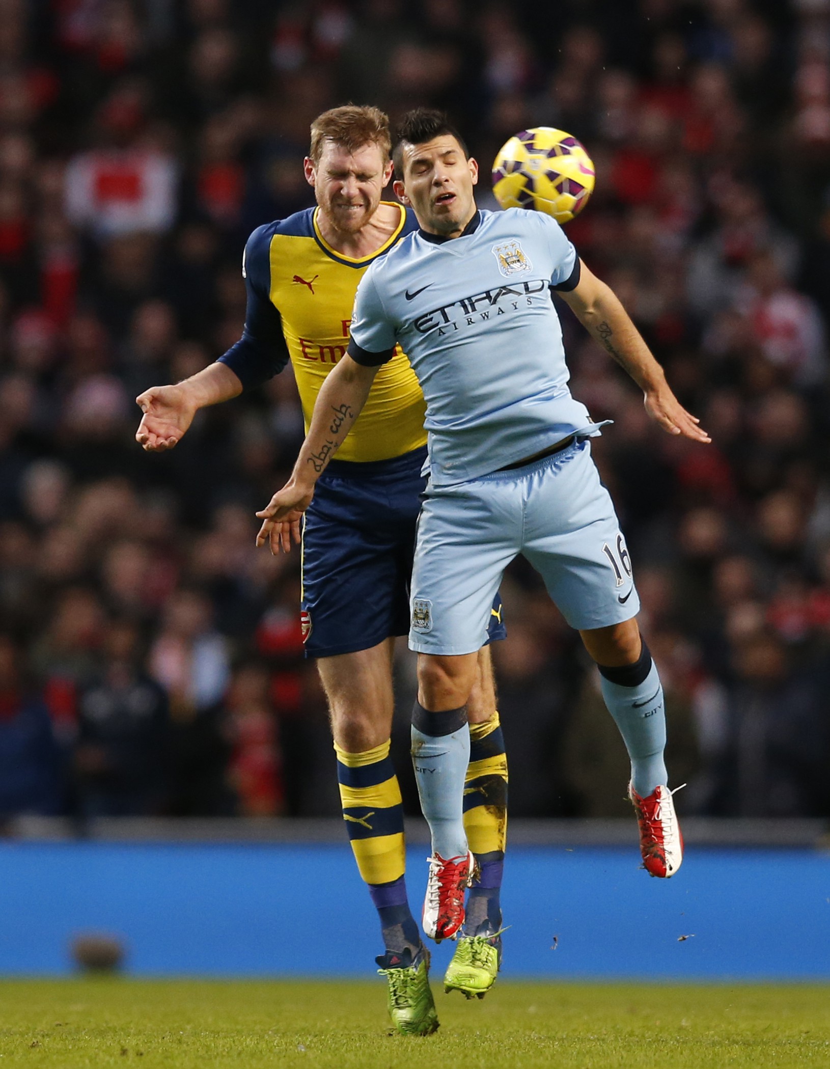 Per Mertesacker (vľavo) a
