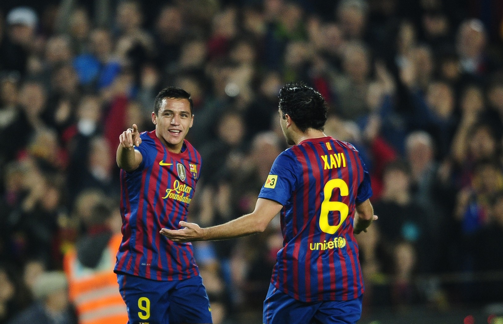 Alexis Sanchez a Xavi