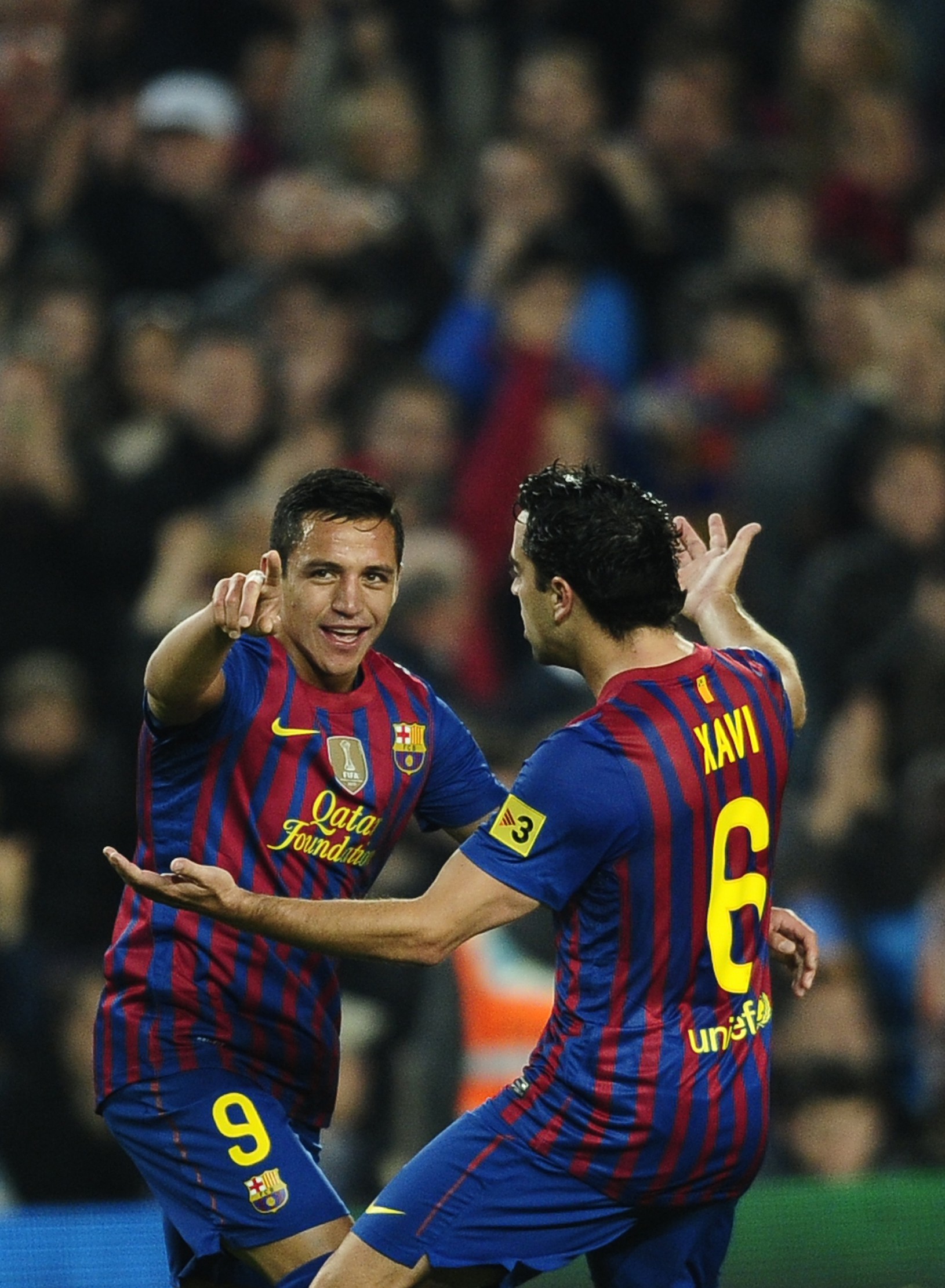 Alexis Sanchez a Xavi