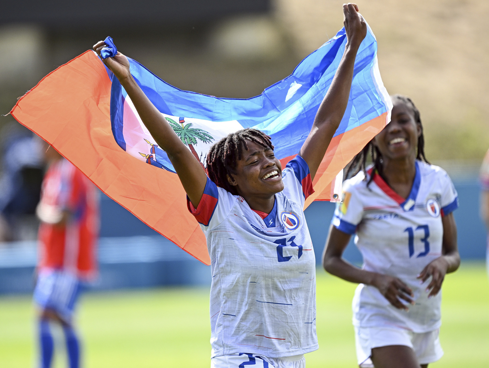 Futbalistky Haiti oslavujú historický