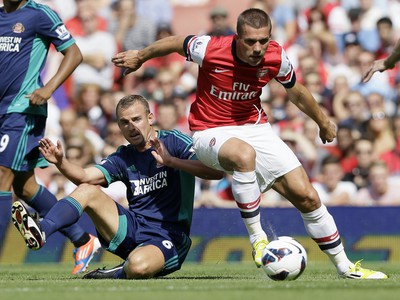Lukas Podolski a Lee Cattermol