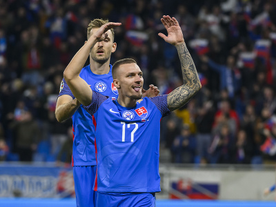 Na snímke zľava Norbert Gyömbér a Lukáš Haraslín (Slovensko) oslavujú gól