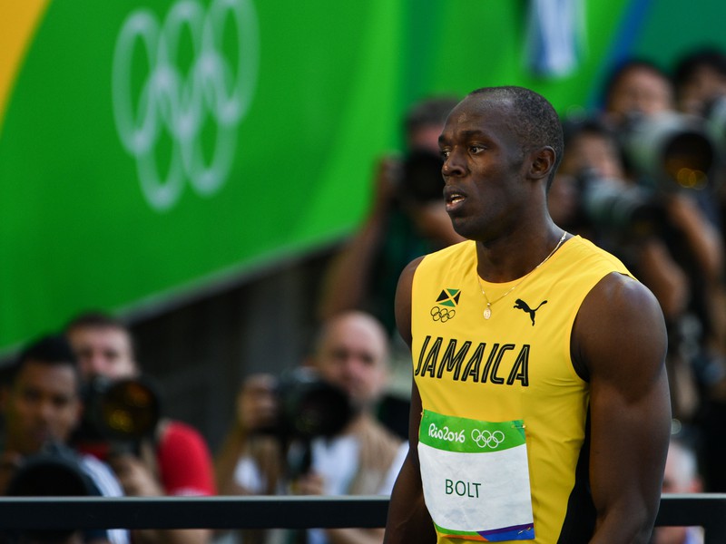 Usain Bolt (Jamajka) počas rozbehu v behu na 100 m